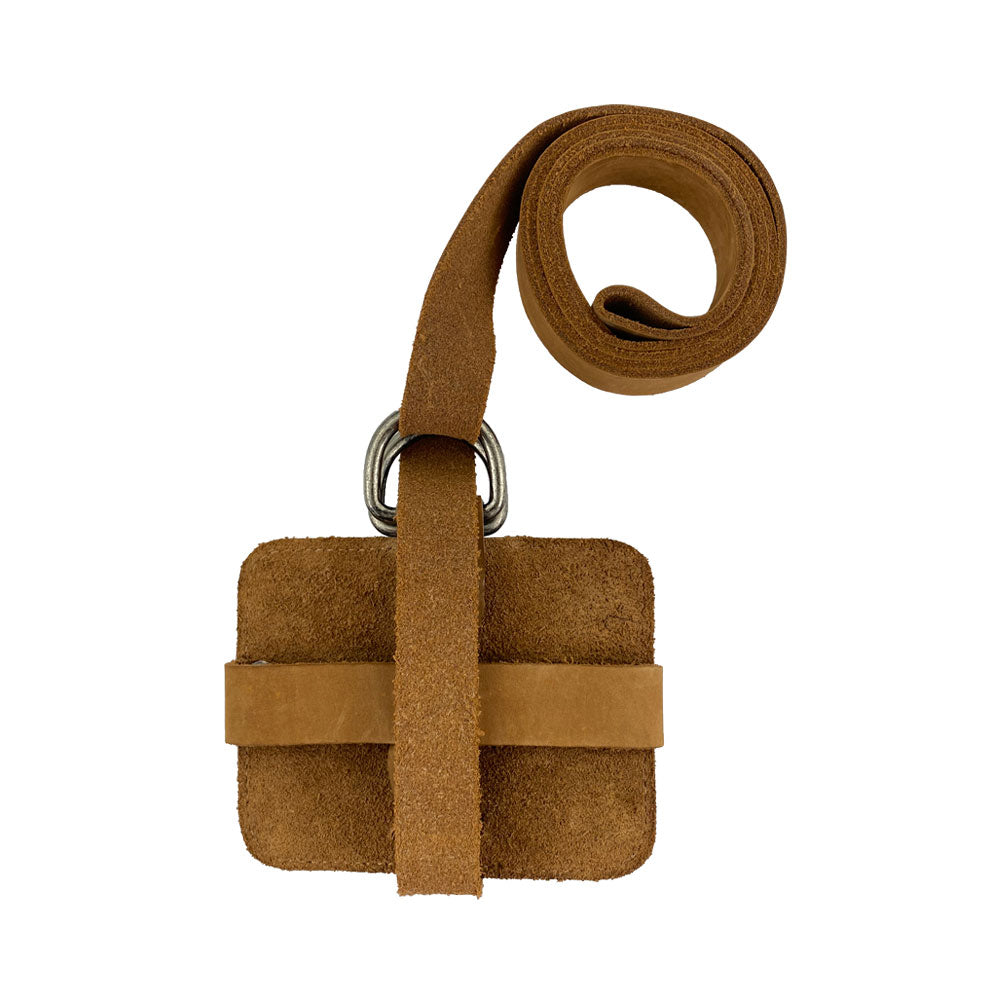 Close-up shot of the Hide & Drink Book Strap Carrier, displaying its design and quality materials. This sturdy Full Grain Leather product is artisan-crafted in La Antigua Guatemala, designed for comfortable book carrying.