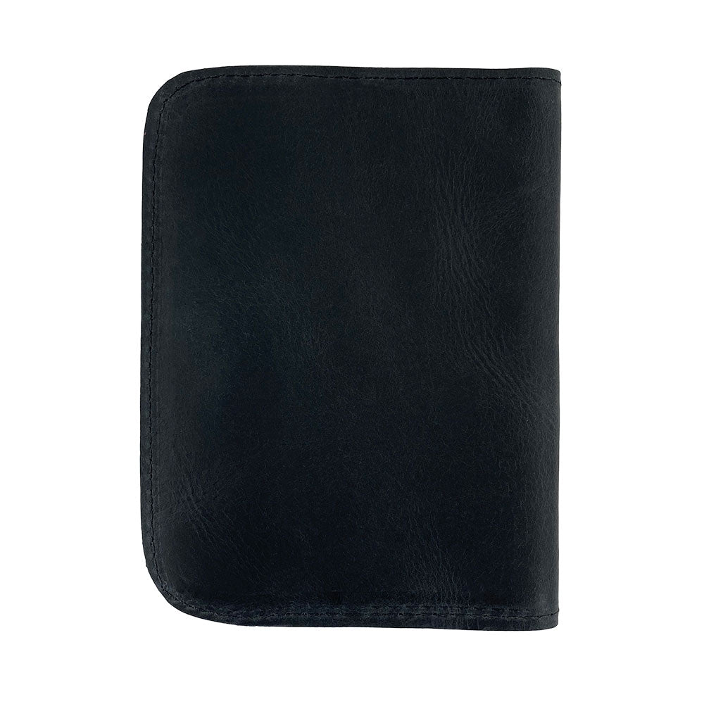 Elegant profile of the Hide & Drink Travel Wallet showcasing its rich leather texture. This handcrafted travel wallet serves as a bifold passport case, made with care in La Antigua Guatemala.