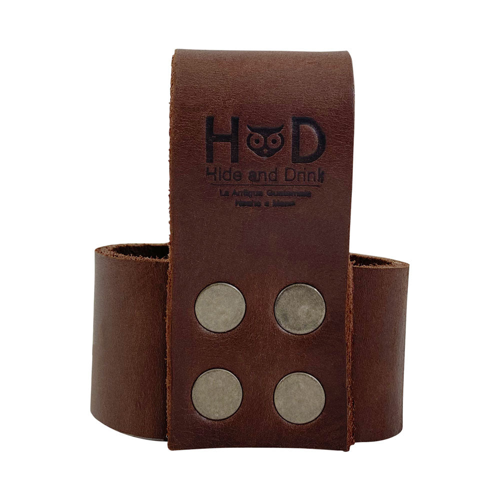 Close-up of the Large Hammer Holster by Hide & Drink, featuring durable full grain leather and fire-branded detailing. Ideal waist axe holster for craftsmen, this rustic tool organizer is perfect for holding your tools securely. Handmade in Oaxaca Mexico with artisan craftsmanship.