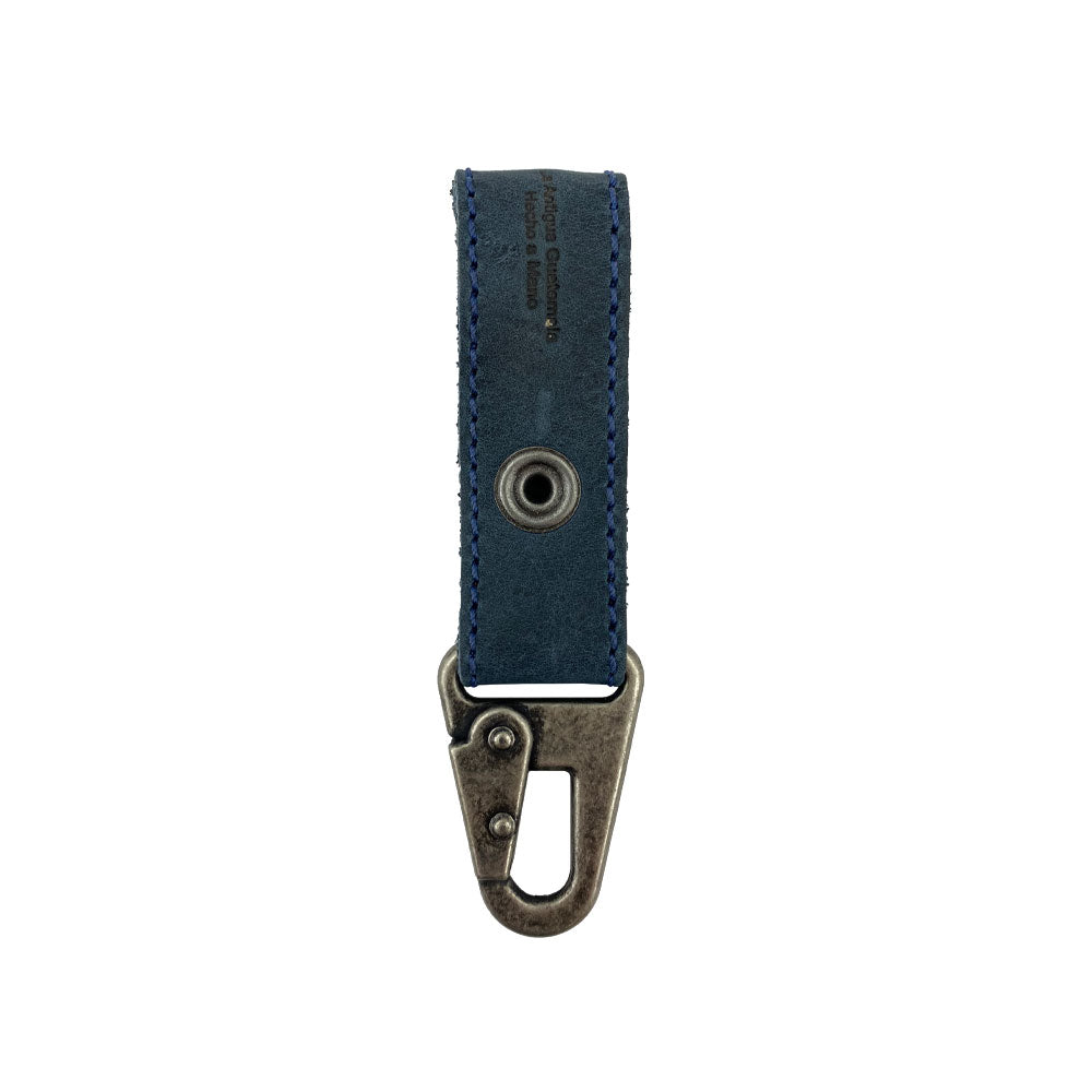 Back view of the blue Key Ring Holder by Hide & Drink, highlighting its rustic design. This Full Grain Leather accessory is made with an emphasis on Small Batch Production and is Hand Made. Artisan quality from La Antigua Guatemala & Oaxaca Mexico.