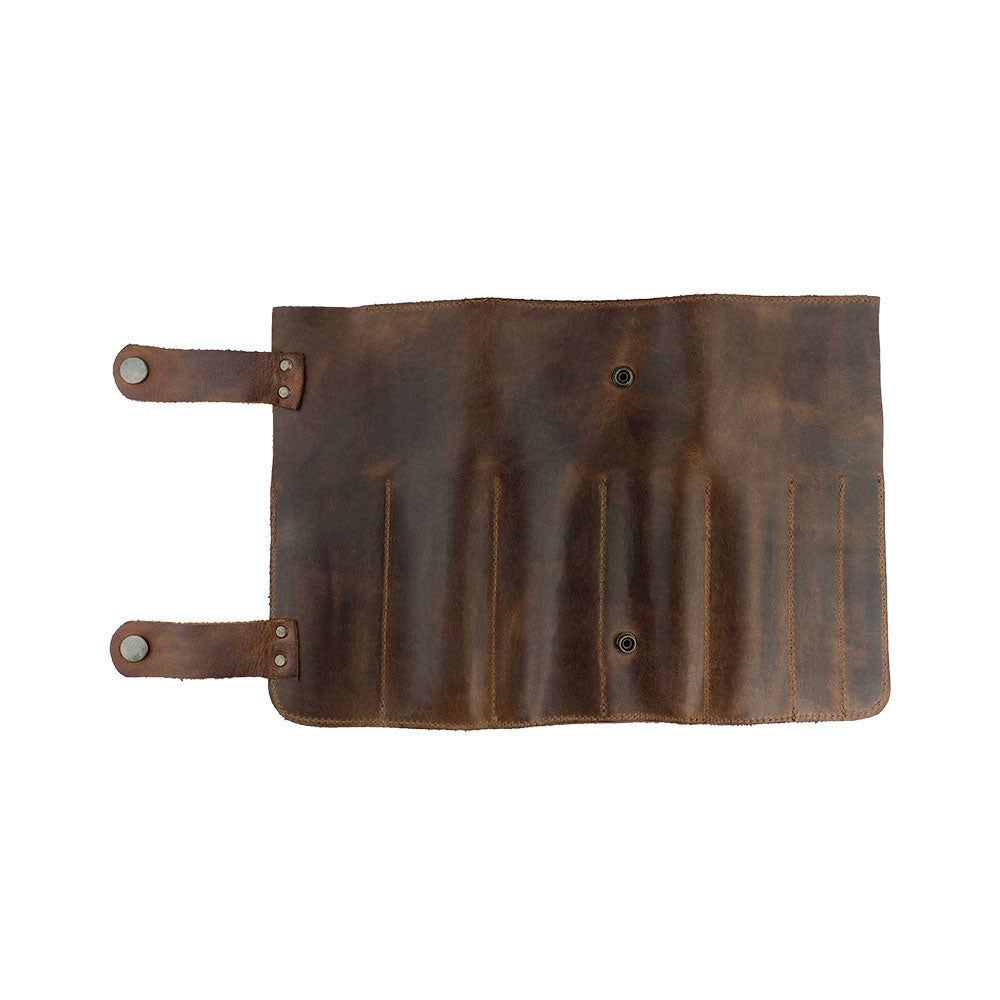 Hide & Drink presents its Barber Tool Roll, showcasing a Snap Tool Roll Up Bag with 14 Slots suitable for scissors & screwdrivers. Made from durable Full Grain Leather, this portable carry case reflects StockyardX's artisan craftsmanship and commitment to small batch production, hand cut, hand sewn, and fire branded in La Antigua Guatemala & Oaxaca Mexico.