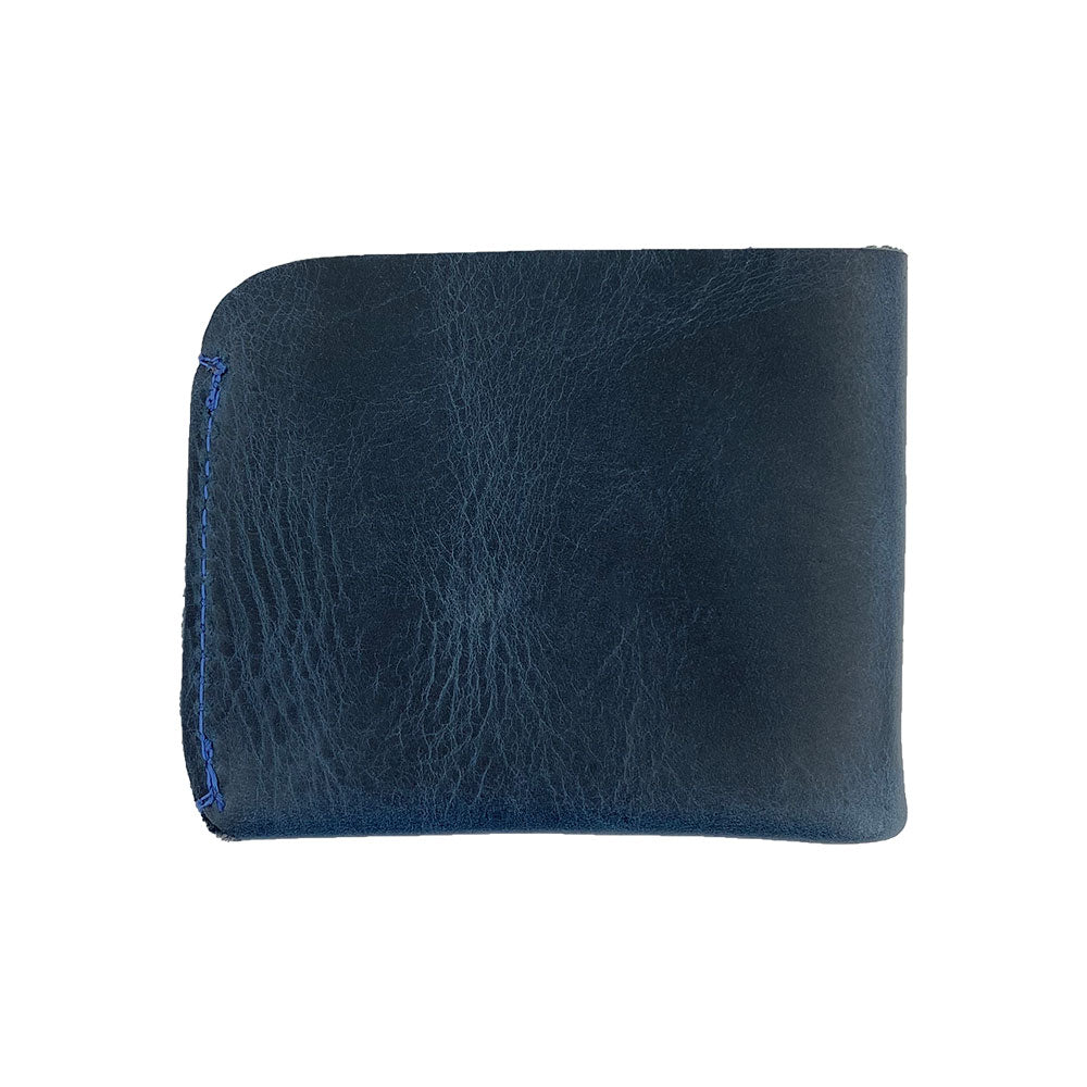 Side view of the Hide & Drink Minimal Wallet, featuring luxurious Full Grain Leather. This Classic Slimfold Wallet serves as a practical Card Organizer Holder, suitable as a Travel Accessory, showcasing the artistry of Small Batch Production by artisans in La Antigua Guatemala & Oaxaca Mexico with Hand Cut and Hand Sewn details.