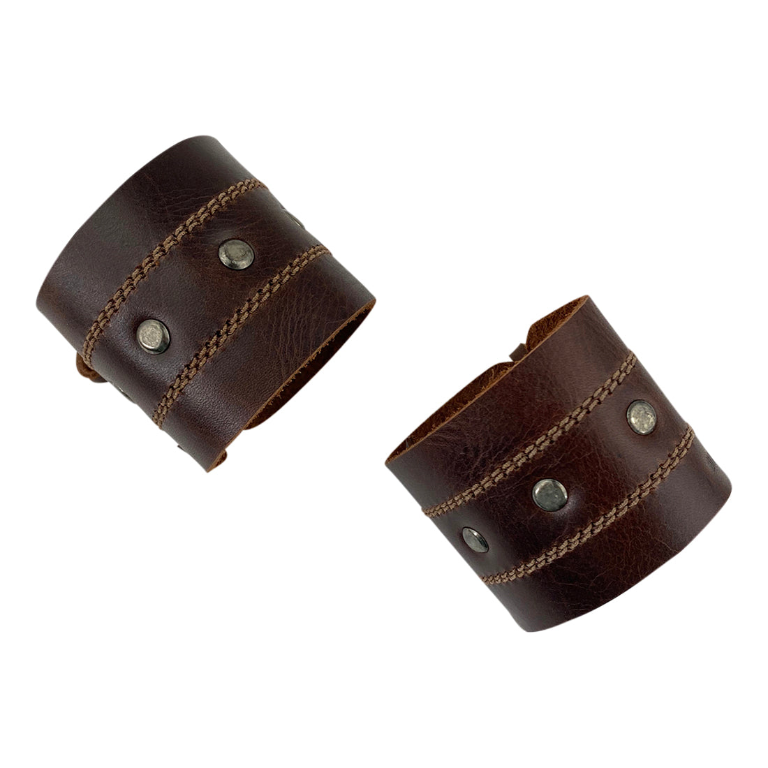 Another angle of the Men's Wristband by Hide & Drink, showcasing its unique structure and rugged style made from premium full grain leather. Perfect for adding a trendy touch to your look, this handmade wristband speaks to the artistry of its creation. Men's Wristband Handmade, Full Grain Leather, StockyardX, Small Batch Production, Hand Cut, Hand Sewn, Fire Branded, Artisan, Handmade in La Antigua Guatemala & Oaxaca Mexico.