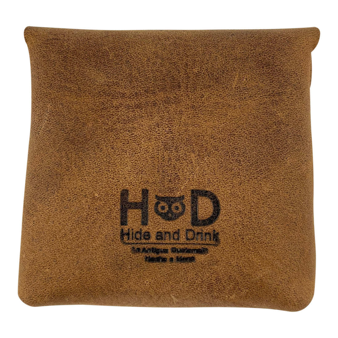 The back view of the Vintage Coin Pouch created by Hide & Drink, featuring a rustic look with the brand logo embossed. This pouch is not only a practical accessory but also a stylish addition to your collection. Cigarette Pack Cover/Holder/Tobacco Case/Accessories, Full Grain Leather, StockyardX, Small Batch Production, Hand Cut, Hand Sewn, Fire Branded, Artisan, Handmade in La Antigua Guatemala & Oaxaca Mexico.