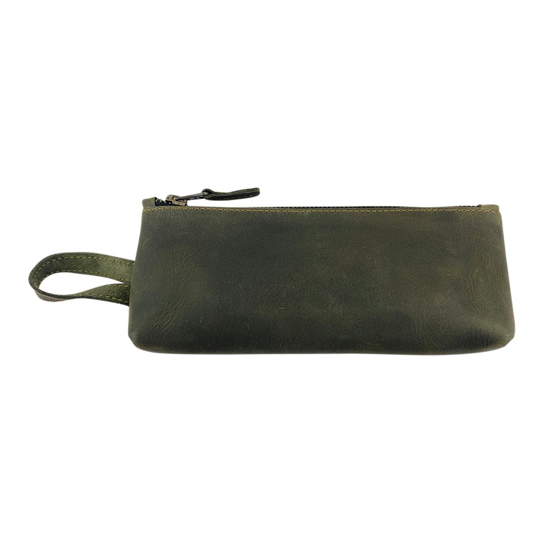 Hide & Drink's X Stitched Case, a functional and stylish green leather storage option for pens and toiletries. This artisan-crafted item highlights the beauty of full grain leather, made in La Antigua Guatemala and Oaxaca, Mexico.