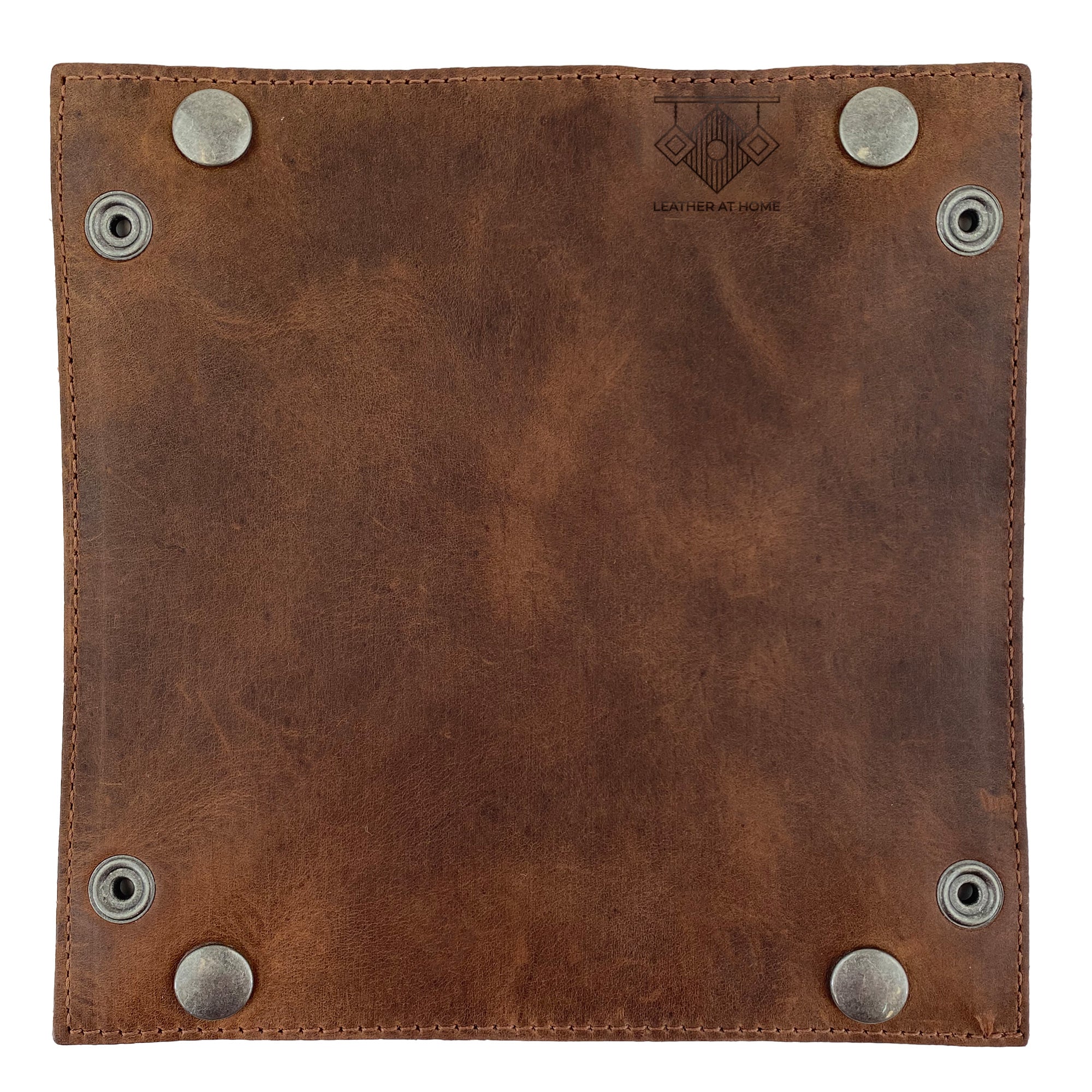 The underside of the Squared Catchall by Leather At Home showcasing the high-quality leather craftsmanship. This coin box or storage valet is perfect for keeping your personal items organized with a touch of elegance, made with artisan techniques in Oaxaca Mexico.