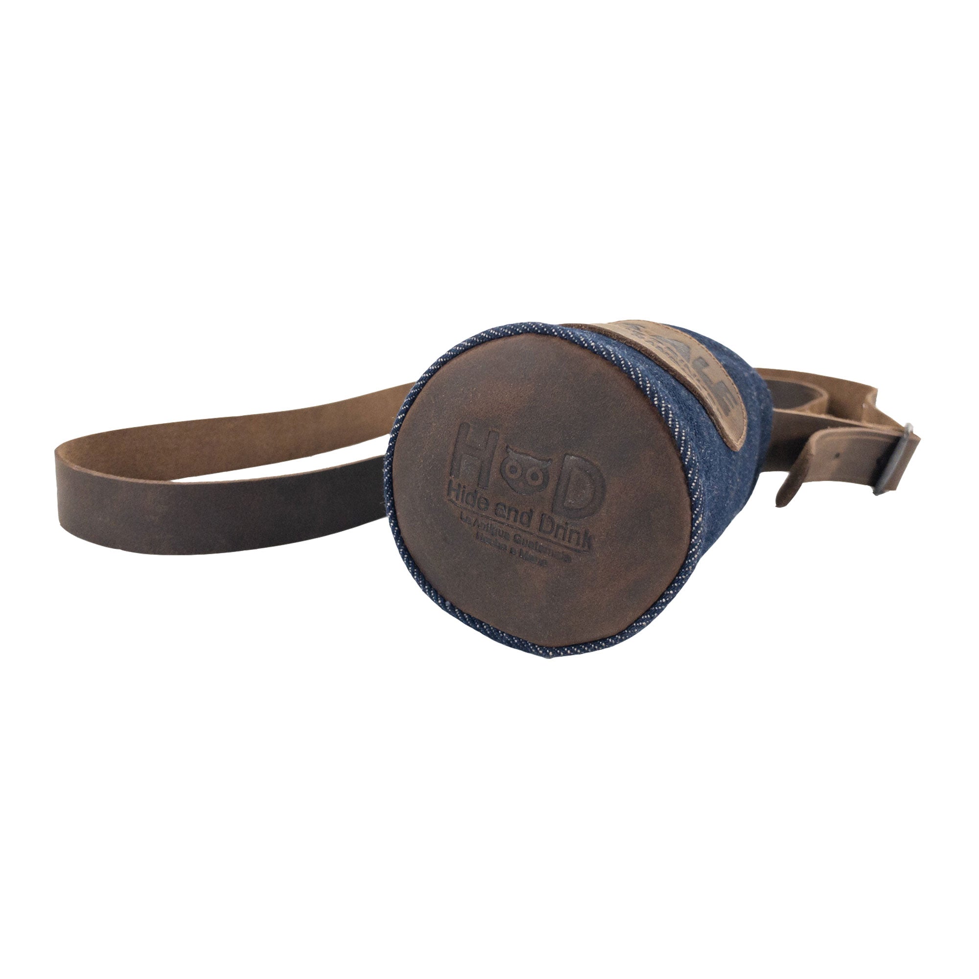 The base of the Over Ale Hands-Free Beer Strap by Hide & Drink showcasing its unique design, made from repurposed denim and full grain leather. StockyardX highlights artisan quality with small batch production, hand cut, hand sewn, and fire branded features, handmade in La Antigua Guatemala and Oaxaca Mexico.