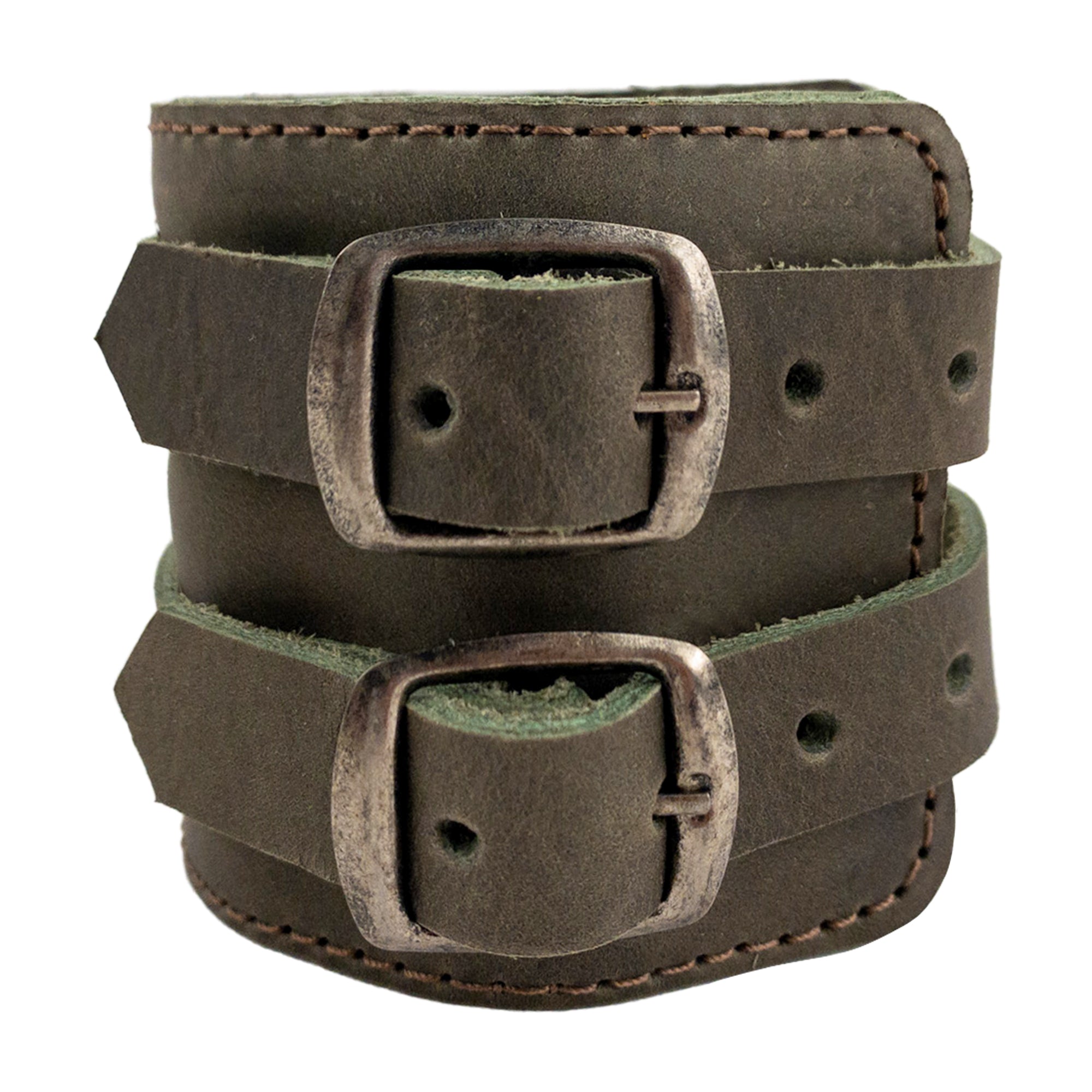 An appealing close-up of Hide & Drink's Wrist-Wallet-Cuff reveals its rustic leather charm, crafted from Full Grain Leather. This stylish bracelet includes a hidden pouch for bills and an inner zippered pouch, catering to modern functionality. Each item is artisanship made in La Antigua Guatemala & Oaxaca Mexico, celebrating quality.