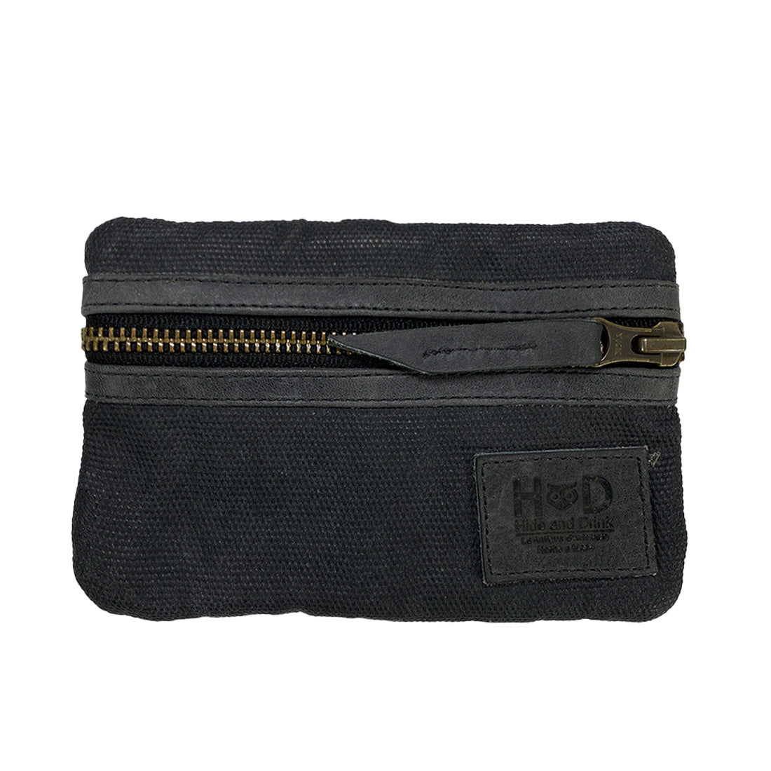 Close-up of the zippered Multi-tool Pocket Pouch in black by Hide & Drink, illustrating its rugged waxed canvas and full grain leather construction.