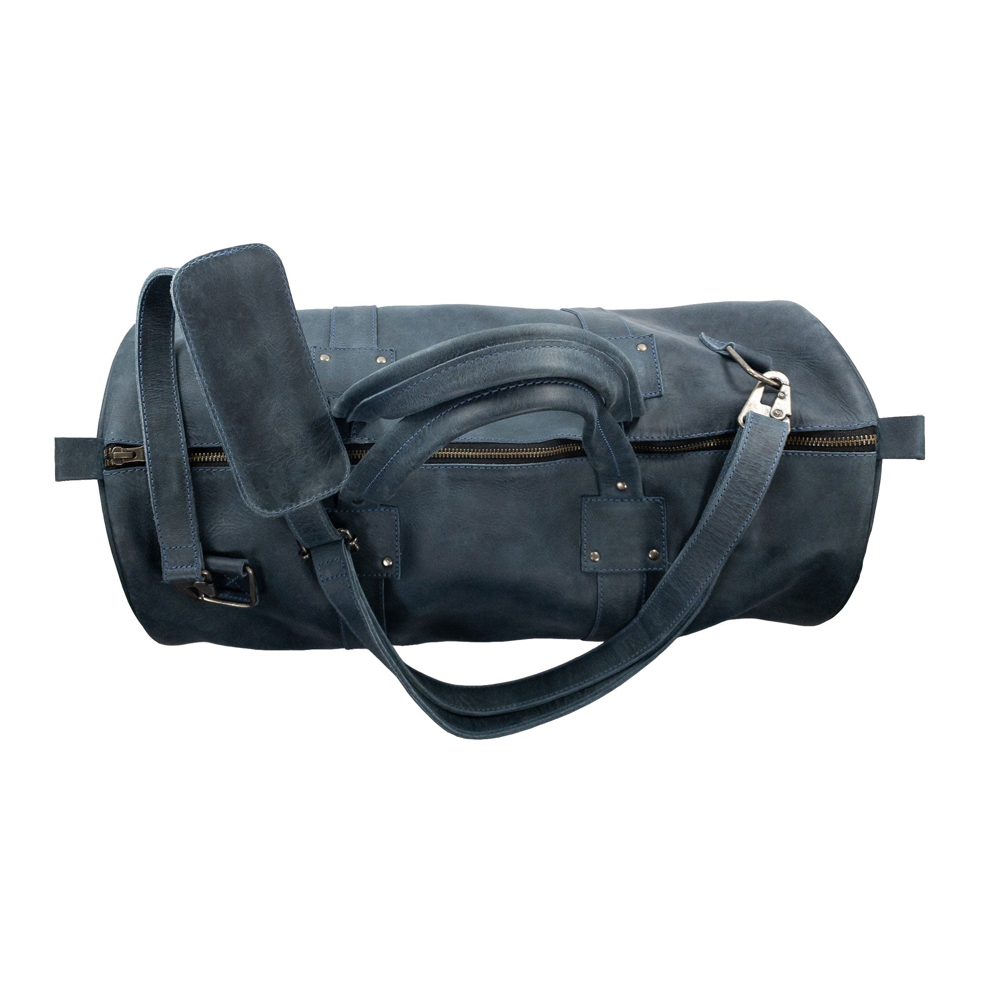 Classic Duffle Bag by Hide & Drink in dark brown leather, showcasing its elegant design and practical features such as zipper closure and adjustable strap. This luxurious Full Grain Leather Classic Duffle Bag is a perfect Messenger Bag, made by artisans in La Antigua Guatemala & Oaxaca Mexico.