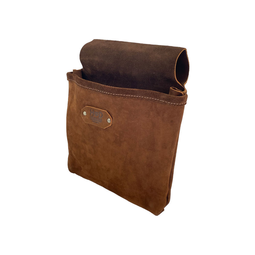Side view of the Constructor Belt Bag in bourbon brown by Hide & Drink, an essential tool bag for constructors. Featuring a single large pocket, it's made from full grain leather and handcrafted in La Antigua Guatemala & Oaxaca Mexico.