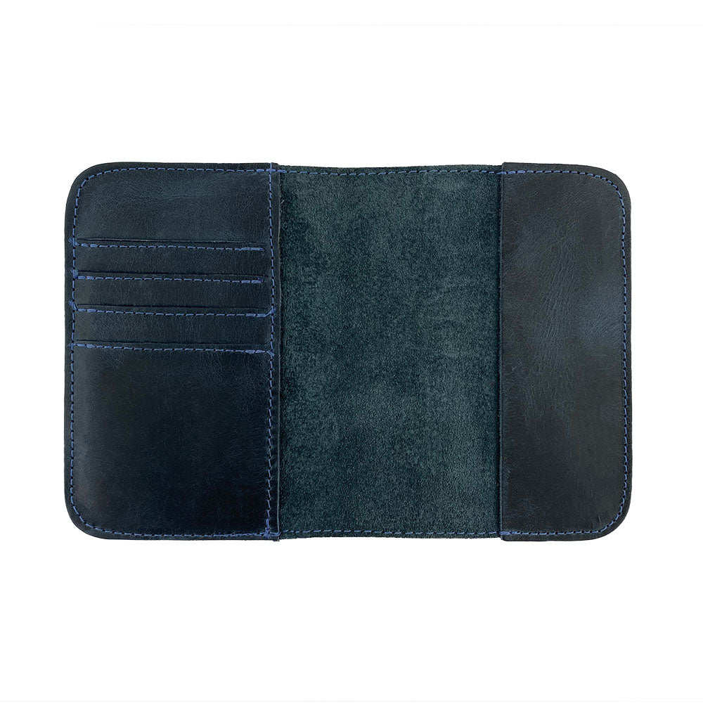 Close-up view of the Hide & Drink Travel Wallet demonstrating its construction quality. This artisan-crafted travel wallet acts as a bifold passport case, made from full grain leather in La Antigua Guatemala.