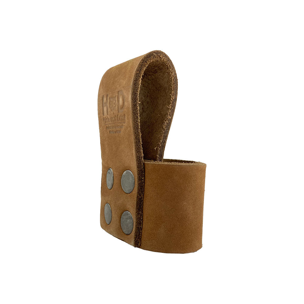 Large Hammer Holster by Hide & Drink, showing versatility in a working environment with a hammer safely stored. A beautiful waist axe holster crafted from full grain leather, making it the ultimate rustic tool organizer. Small batch production ensures authenticity in La Antigua Guatemala.