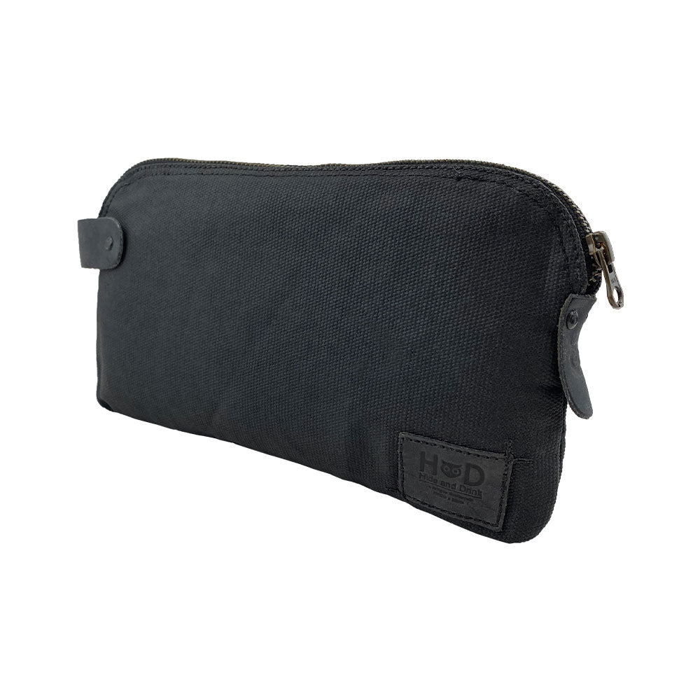 Dopp Kit Utility Bag by Hide & Drink featuring a polished leather finish with multipurpose features. This artisan Dopp Kit Utility Bag serves as a travel companion made from full grain leather, emphasizing small batch production with hand cut and hand sewn details, handmade in La Antigua Guatemala & Oaxaca Mexico.