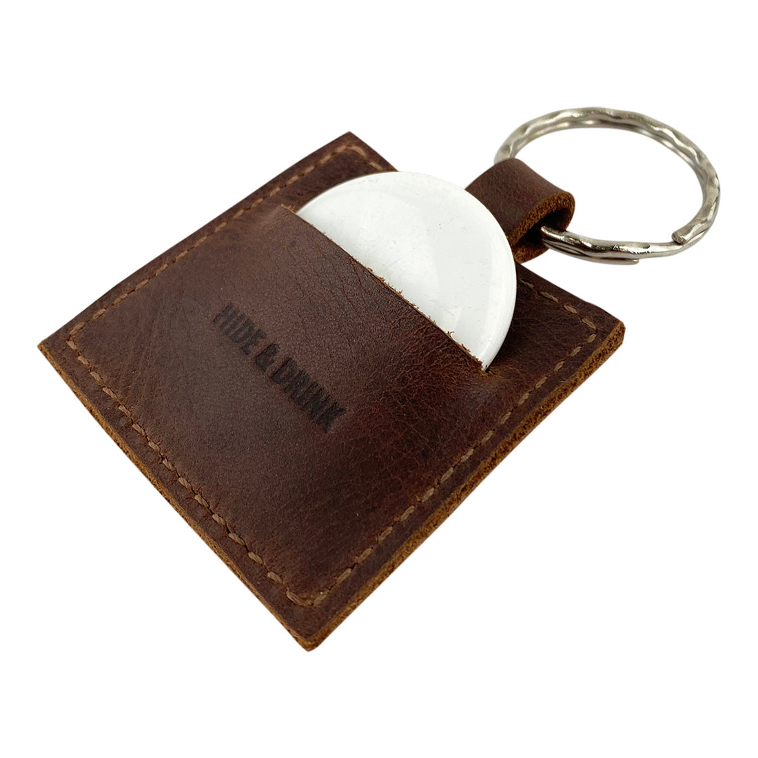 AirTag Squared Keychain by Hide & Drink, expertly designed to hold an AirTag securely within its Full Grain Leather exterior. This practical accessory is perfect for tracking personal items, showcasing small batch craftsmanship and artisan details.