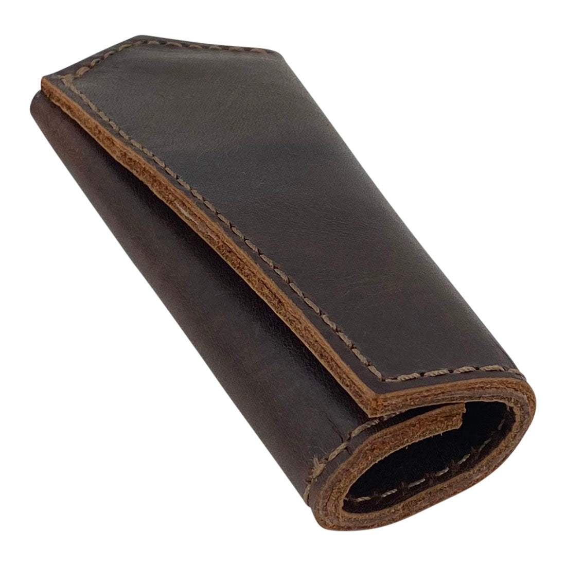 Hide & Drink Hot Pan Handle Cover in a rolled design made from full grain leather, demonstrating the quality of small batch production and artisan craftsmanship. Perfect for protecting hands while cooking, handmade in La Antigua Guatemala & Oaxaca Mexico.