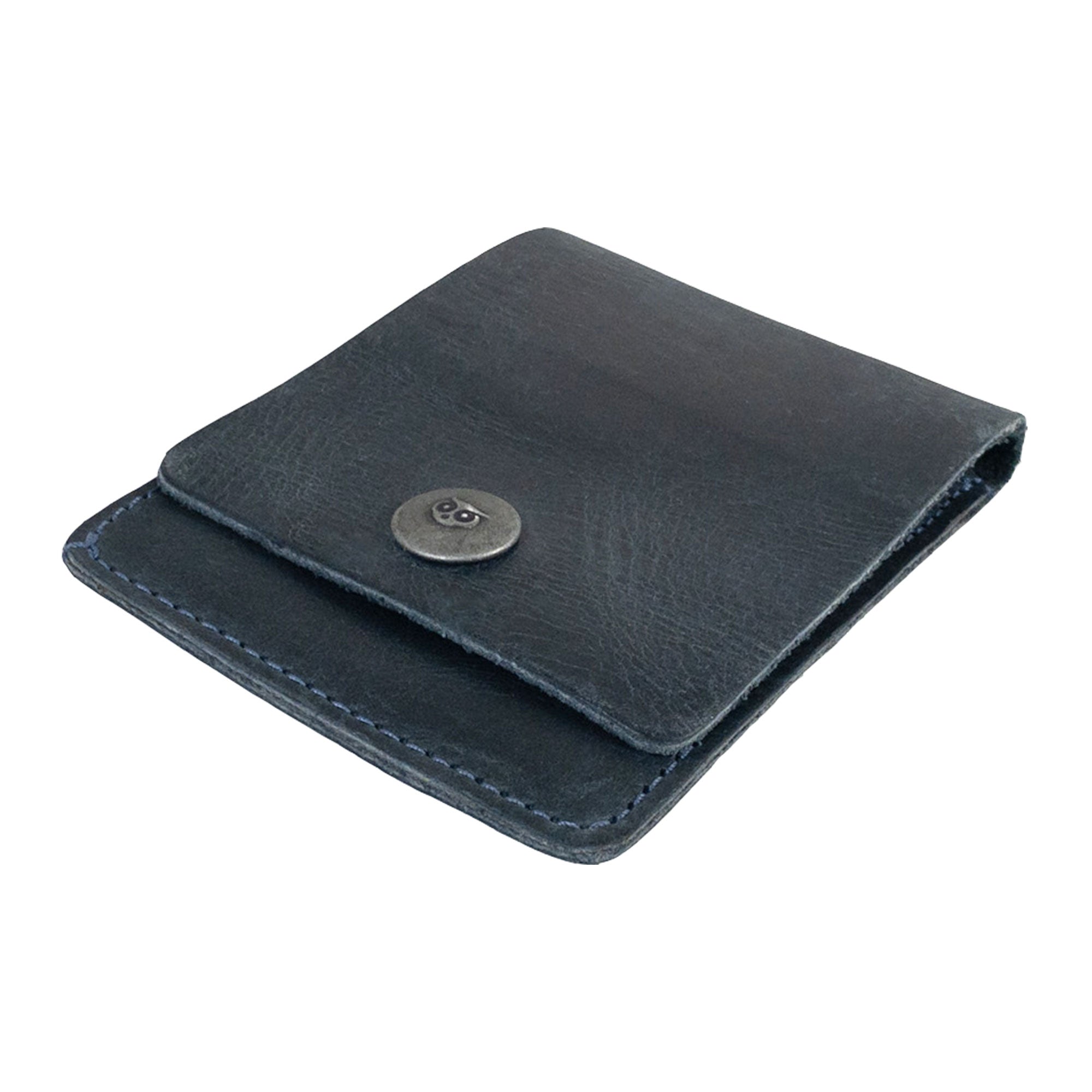 Interior view of the blue Vertical Wallet by Hide & Drink showcasing compartments for cards and notes. This Vertical Front Pocket Wallet with Card Slot provides a stylish solution for compact storage, made from durable full grain leather through small batch production techniques, hand cut and hand sewn with fire branding. Handmade in La Antigua Guatemala & Oaxaca Mexico.