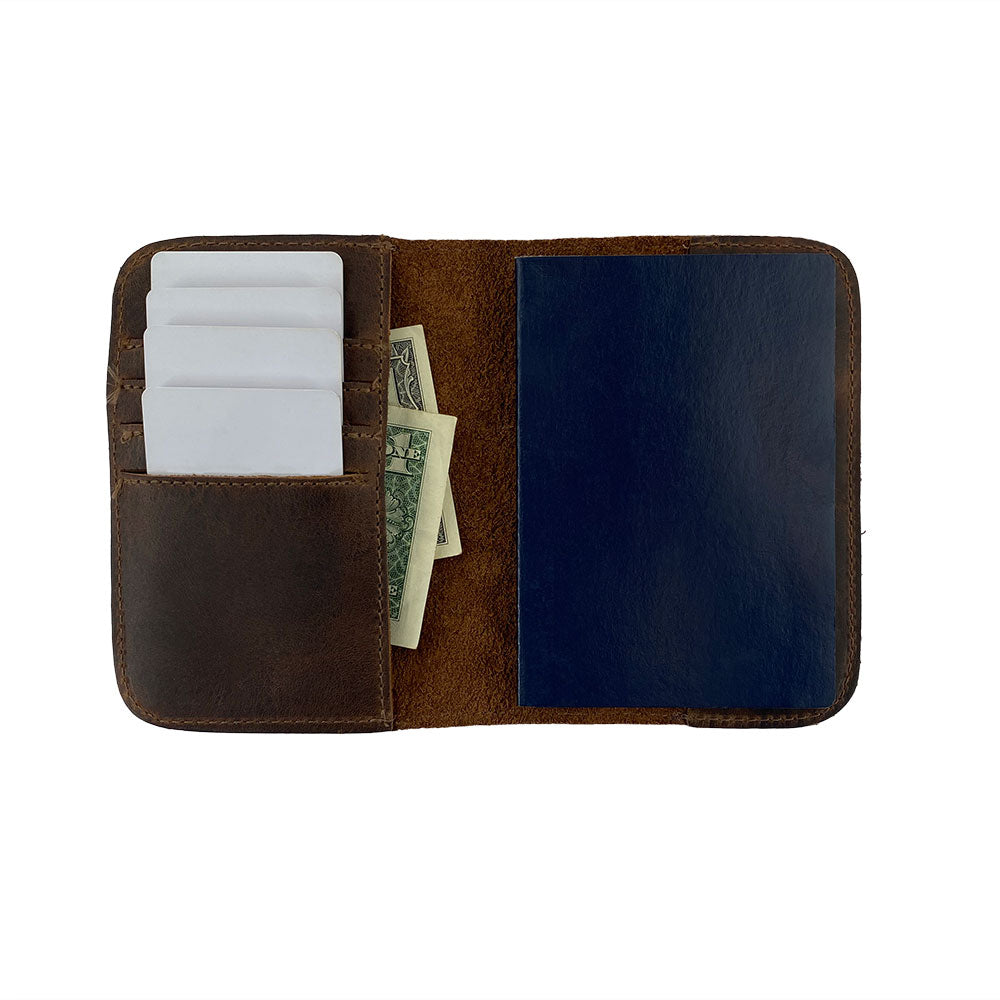 Inside view of the Hide & Drink Travel Wallet showing its pocket layout. This versatile travel wallet is a bifold passport case and card holder, made from premium leather in La Antigua Guatemala.