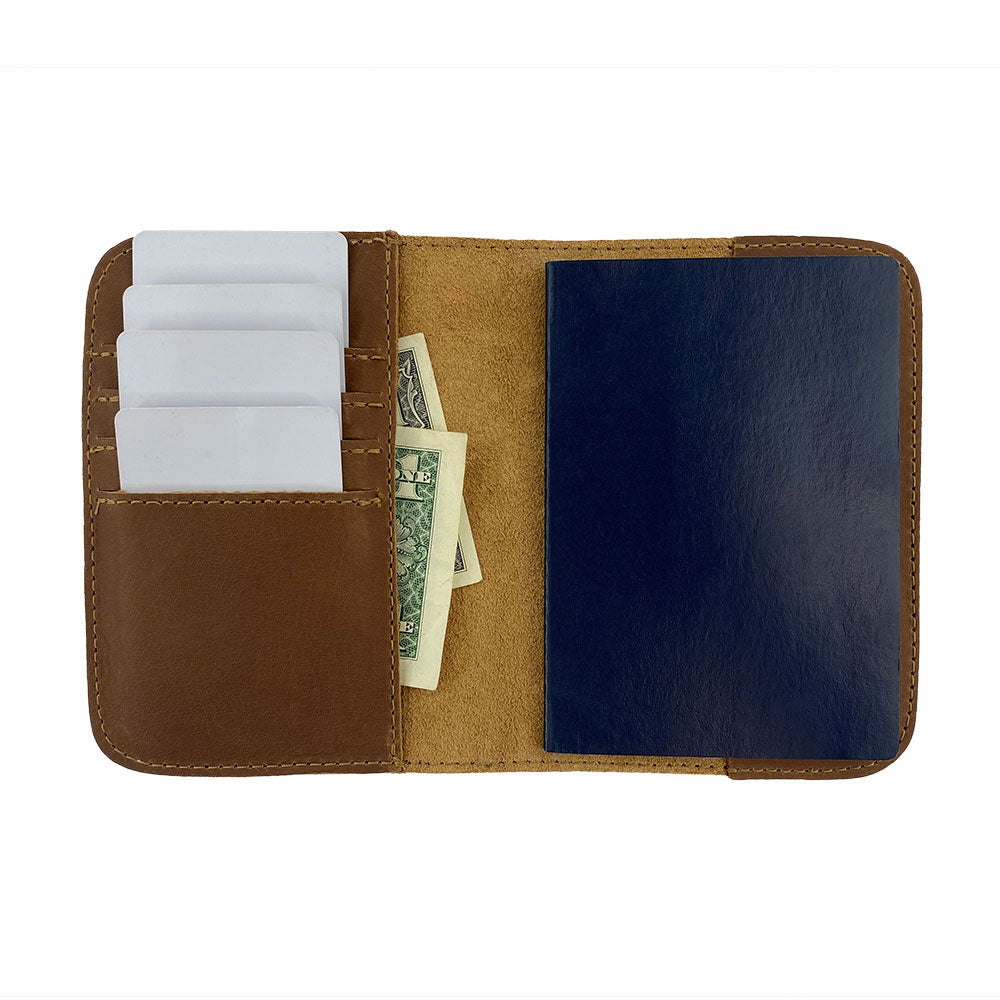 Open view of the Hide & Drink Travel Wallet with space for cash and documents. This leather travel wallet serves as a practical bifold passport case and card holder, lovingly made in La Antigua Guatemala.