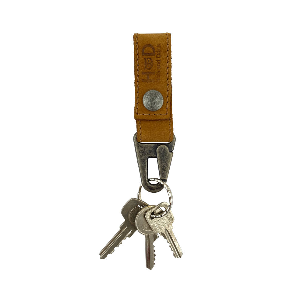 Key Ring Holder by Hide & Drink with keys attached, highlighting its Full Grain Leather design and artisan quality. This handmade piece, crafted in La Antigua Guatemala & Oaxaca Mexico, reflects small batch production and fire branded detail.
