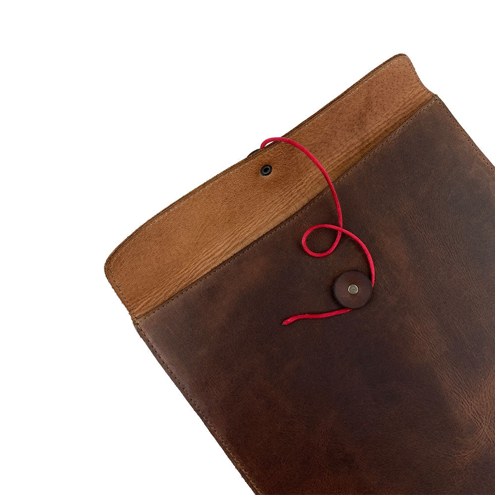 Close-up of the Mailing Envelope Folder by Hide & Drink, showcasing its unique design and craftsmanship. Perfect as a Mailing Envelope Document Holder or Attache, this durable piece features Full Grain Leather material, symbolizing high-quality artisan production from Oaxaca Mexico.