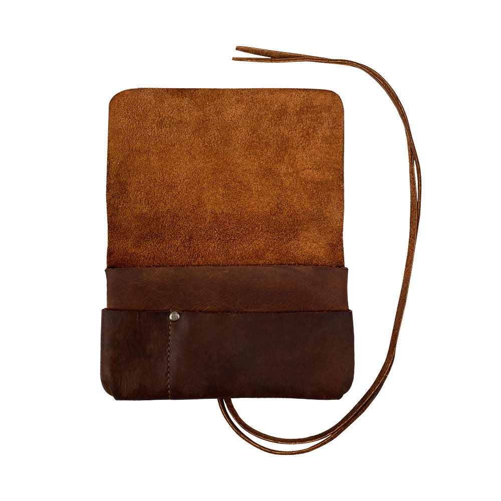 Handcrafted King Size Tobacco Pouch by Hide & Drink made from high-quality Full Grain Leather, serving as a rustic Field Notes Case. This vintage storage solution is perfect for your accessories, embodying small batch production and artisan craftsmanship from La Antigua Guatemala and Oaxaca Mexico.