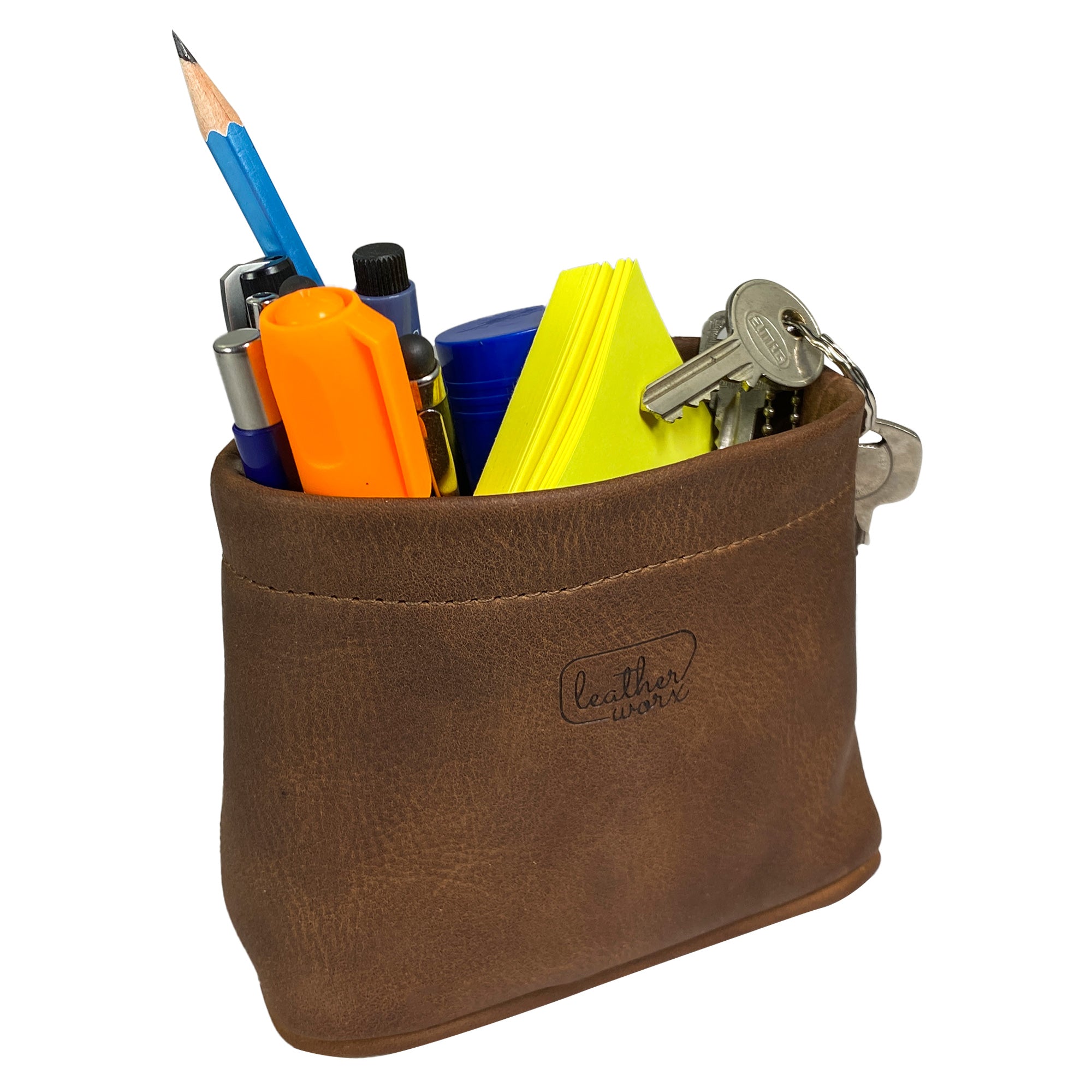 Leather Worx Desk Organizer Bag filled with vibrant school and office supplies, exemplifying its practical use. This durable Desk Organizer Bag, made of full grain leather, is a testament to artisan craftsmanship with hand cut and sewn details, proudly made in La Antigua Guatemala & Oaxaca Mexico.