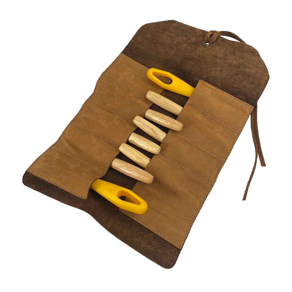 Hide & Drink Tool Roll presents a classic small tool roll-up bag with 10 slots, constructed using durable full grain leather. Ideal as a portable carry-on pouch for your woodworking tools, it elevates your workshop storage options. Hand cut and sewn by skilled artisans in La Antigua Guatemala & Oaxaca Mexico.