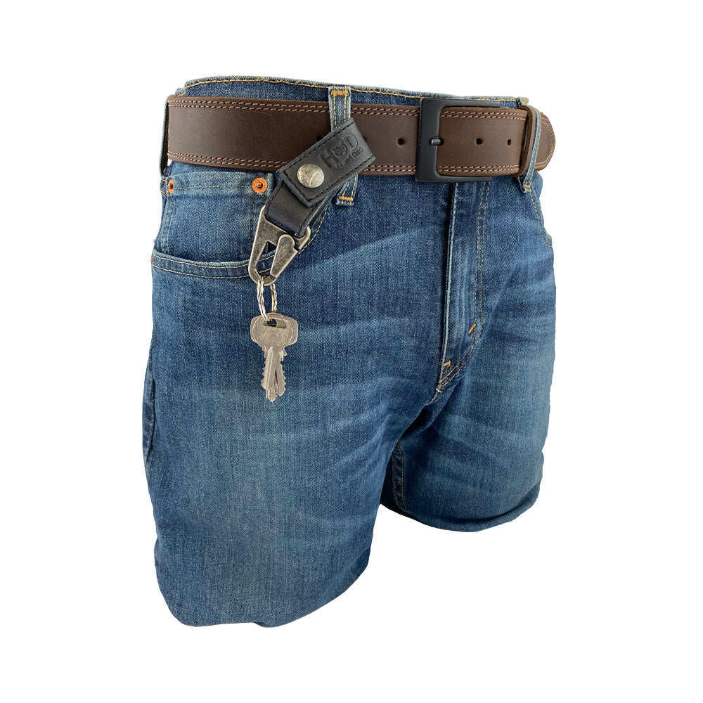 Key Ring Holder by Hide & Drink displayed on a belt, made of Full Grain Leather, ideal for easy access to keys. This artisan piece showcases handmade quality from La Antigua Guatemala & Oaxaca Mexico, along with its small batch production process.