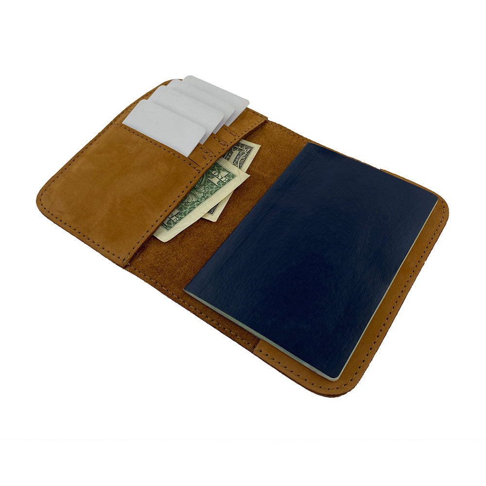 Side view of the Hide & Drink Travel Wallet revealing its craftsmanship. This high-quality travel wallet is a bifold passport case beautifully made from full grain leather in La Antigua Guatemala.