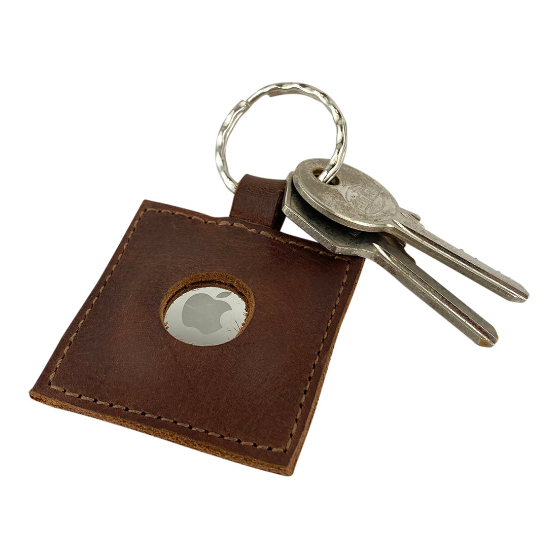 Close-up of the AirTag Squared Keychain by Hide & Drink, showcasing its Full Grain Leather and keyring attachment, ideal for tracking personal items. This artisan-crafted Squared AirTag Keychain is a merging of technology and durable design.