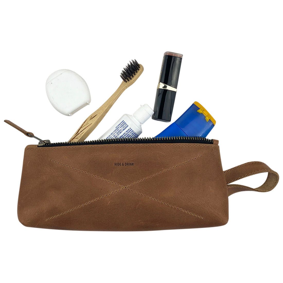 Hide & Drink's X Stitched Case, a beautifully crafted storage solution, perfect for travel and organization, is made from high-quality full grain leather. Hand sewn and cut by artisans in La Antigua Guatemala and Oaxaca, Mexico, it represents elegant design.