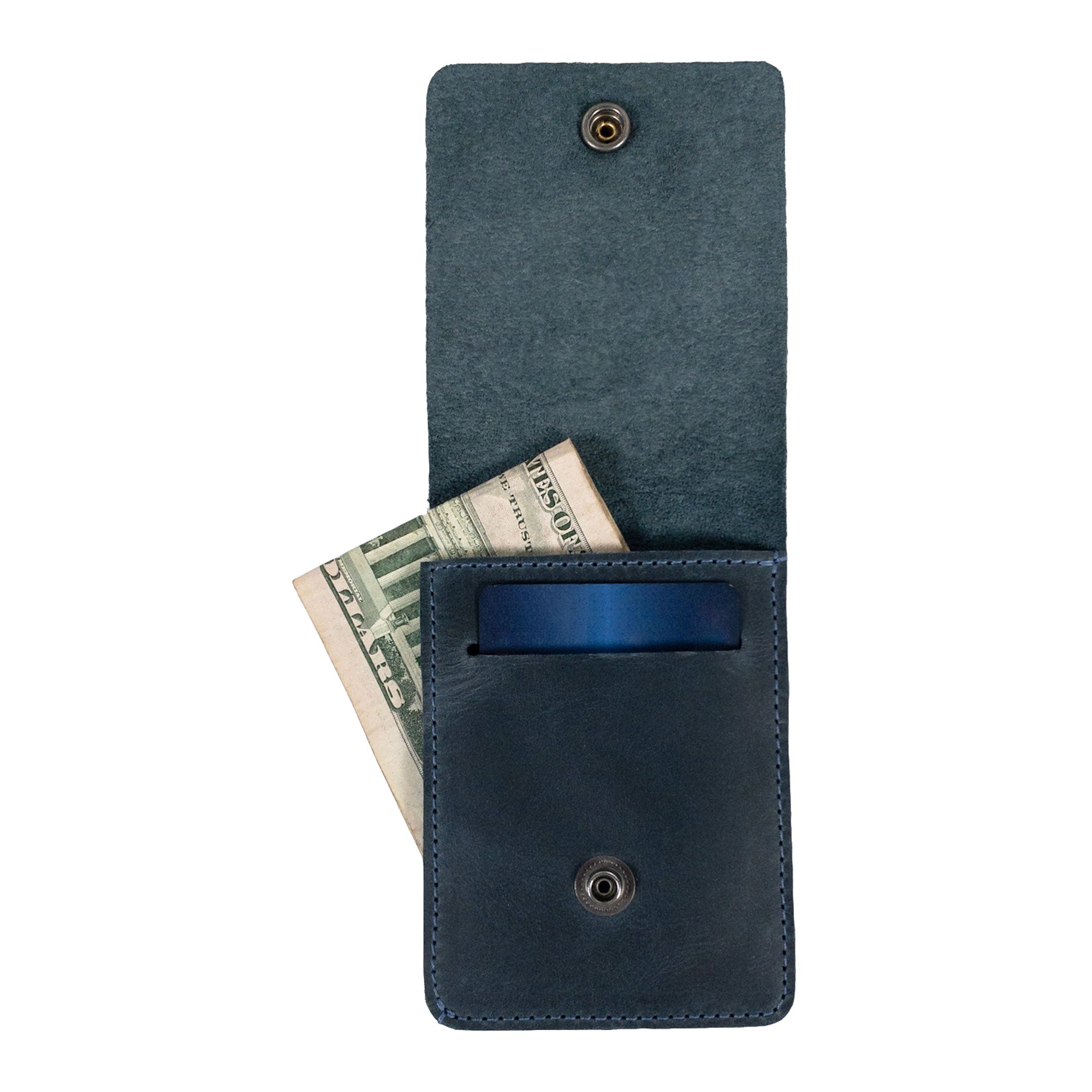 Side view of the blue Vertical Wallet by Hide & Drink illustrating its sleek design. This Vertical Front Pocket Wallet with Card Slot is designed for compact storage of bills and supports card holder functionality, made from high-quality full grain leather, emphasizing small batch production with hand cut and hand sewn features, fire branded for a unique flair. Handmade in La Antigua Guatemala & Oaxaca Mexico.