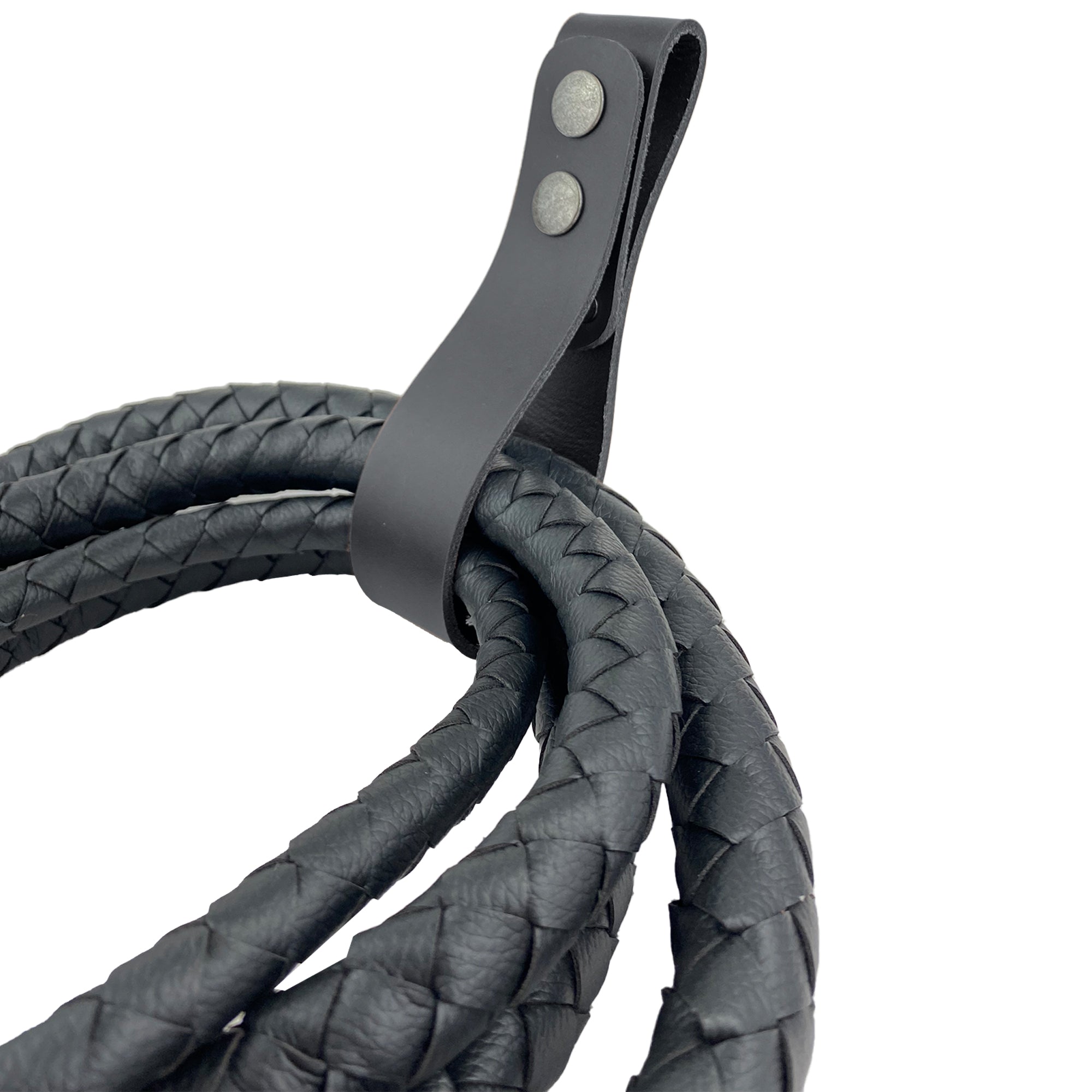 The black Thick Whip Holder by Hide & Play, illustrated next to a measuring guide, highlighting its functionality as a whip holster made from thick full grain leather. This versatile belt loop bullwhip holder excels for pastoral tools, embodying the artistry of small batch production through hand cut, hand sewn features and fire branded craftsmanship, all handmade in La Antigua Guatemala & Oaxaca Mexico.