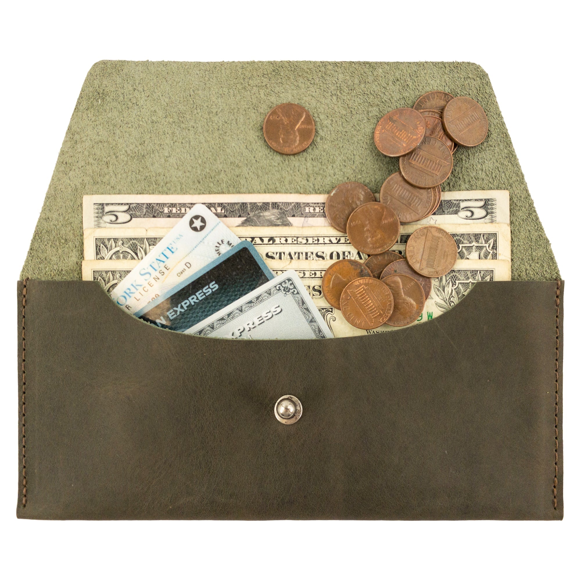 The Long Utility Pouch by Hide & Drink stuffed with coins and cash, highlighting its convenience and infusing style into everyday use. Great for keeping your essentials organized.