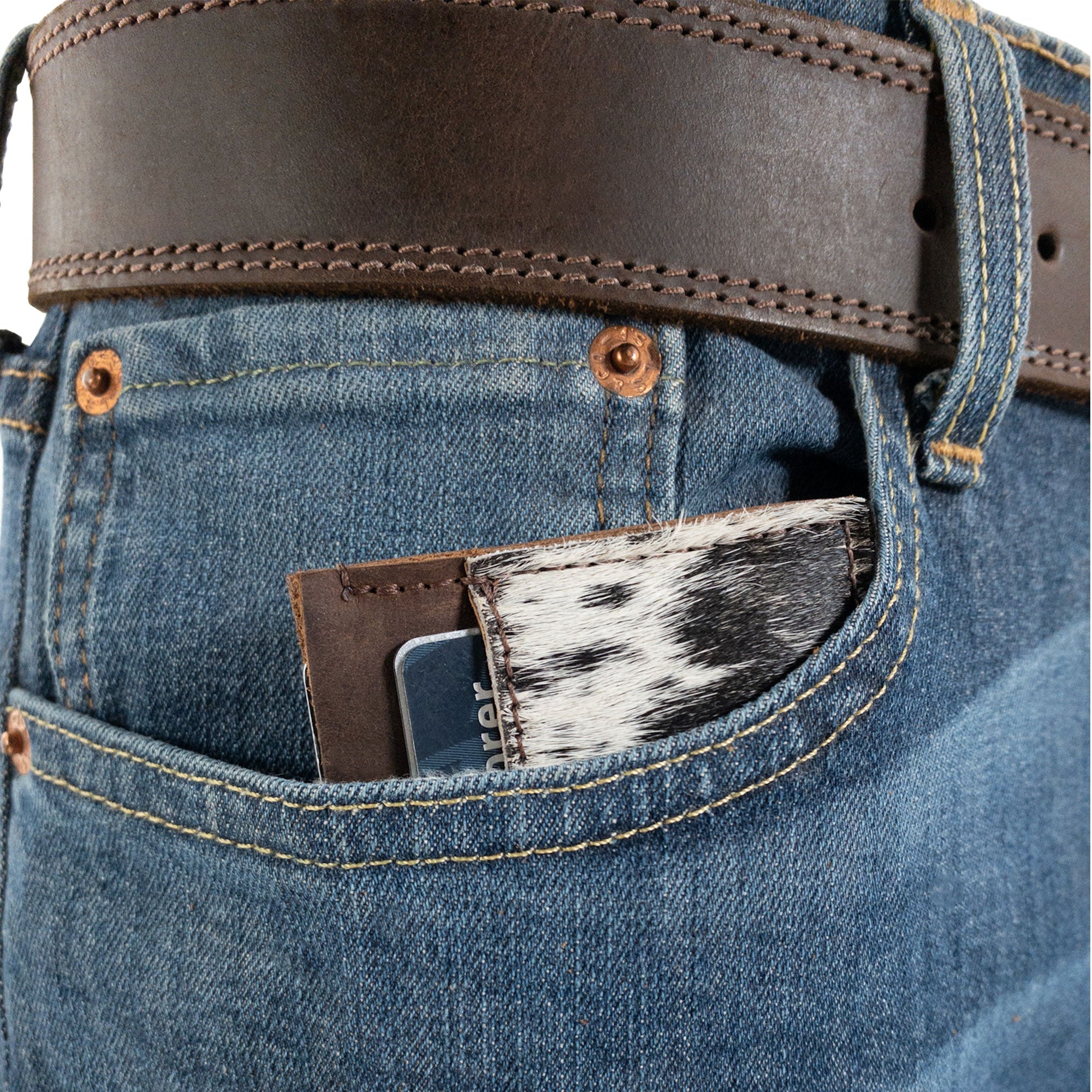 Western Leather Works Double Card Wallet tucked into a back pocket. This stylish Minimalist Rodeo Wallet provides a compact storage solution for everyday essentials. Handmade in La Antigua Guatemala from full grain leather, this ID holder is crafted with small batch production principles, featuring fire branding for authenticity.