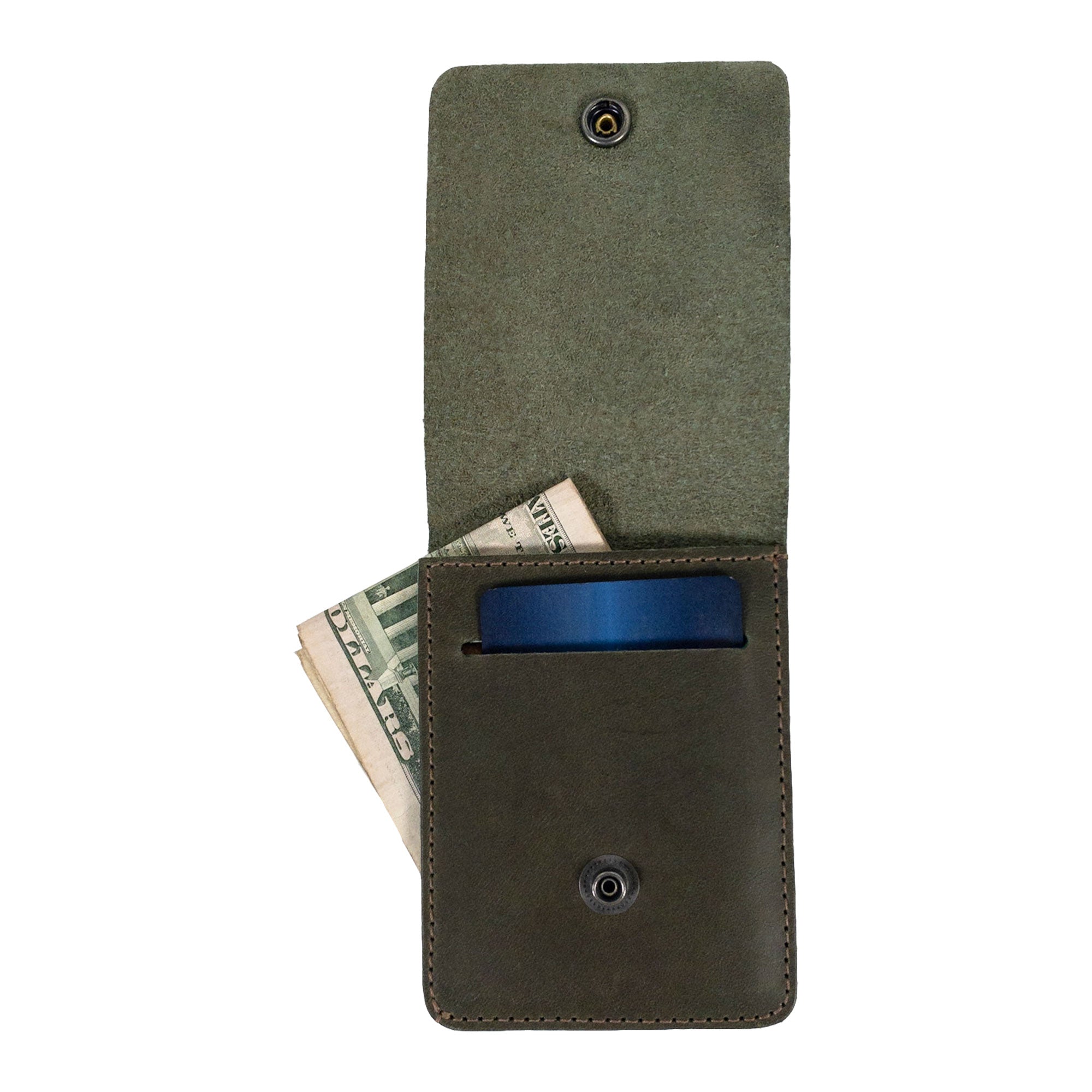 Side view of the green Vertical Wallet by Hide & Drink showcasing its compact profile. This Vertical Front Pocket Wallet with Card Slot provides stylish storage for bills and cards, crafted of full grain leather through small batch processes with hand cut and hand sewn artistry, fire branded for a unique touch. Handmade in La Antigua Guatemala & Oaxaca Mexico.