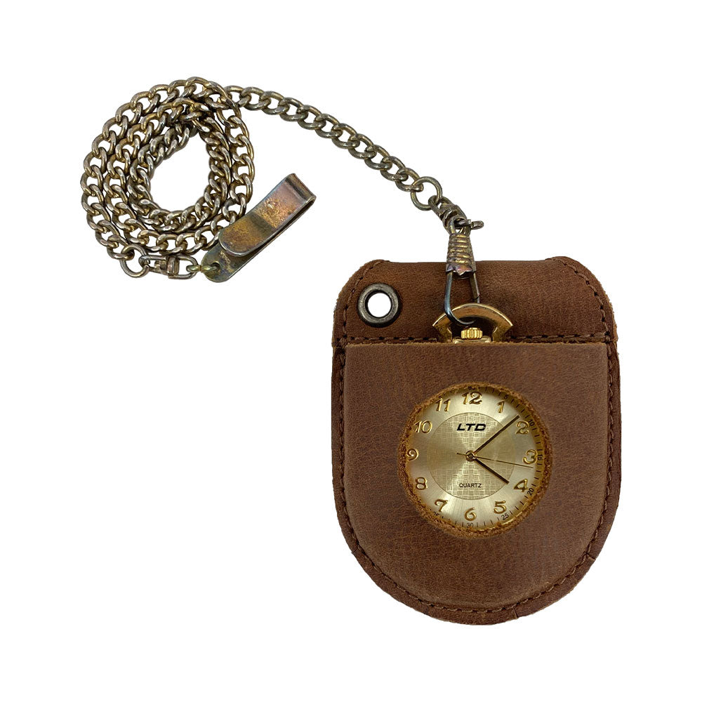 Hide & Drink Pocket Watch Holder and Case displaying a vintage pocket watch, combining style with function. This pocket watch case acts as a rustic protector holder crafted from full grain leather with detailed hand stitching and fire branding, part of small batch production and artisan quality. Handmade in La Antigua Guatemala & Oaxaca Mexico.