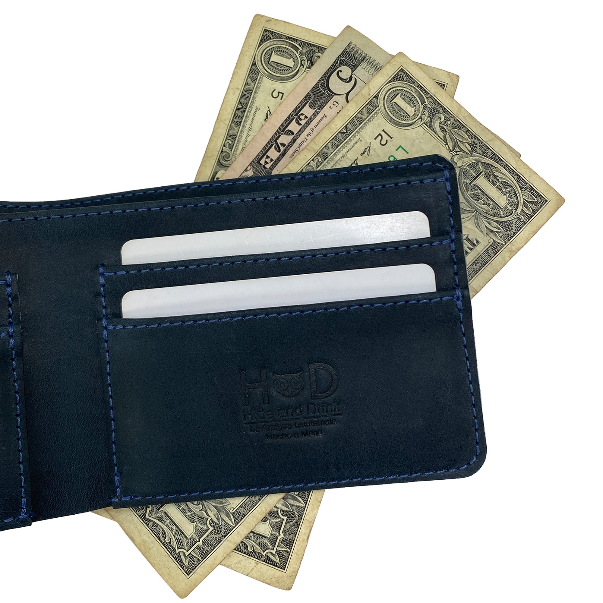 Close-up of Hide & Drink's blue Bifold Wallet dimensions for compact storage. This Slim Bifold Wallet is a classic billfold designed to hold cash and cards, ideal as a travel accessory, crafted from quality full grain leather, artisan handmade in La Antigua Guatemala & Oaxaca Mexico.
