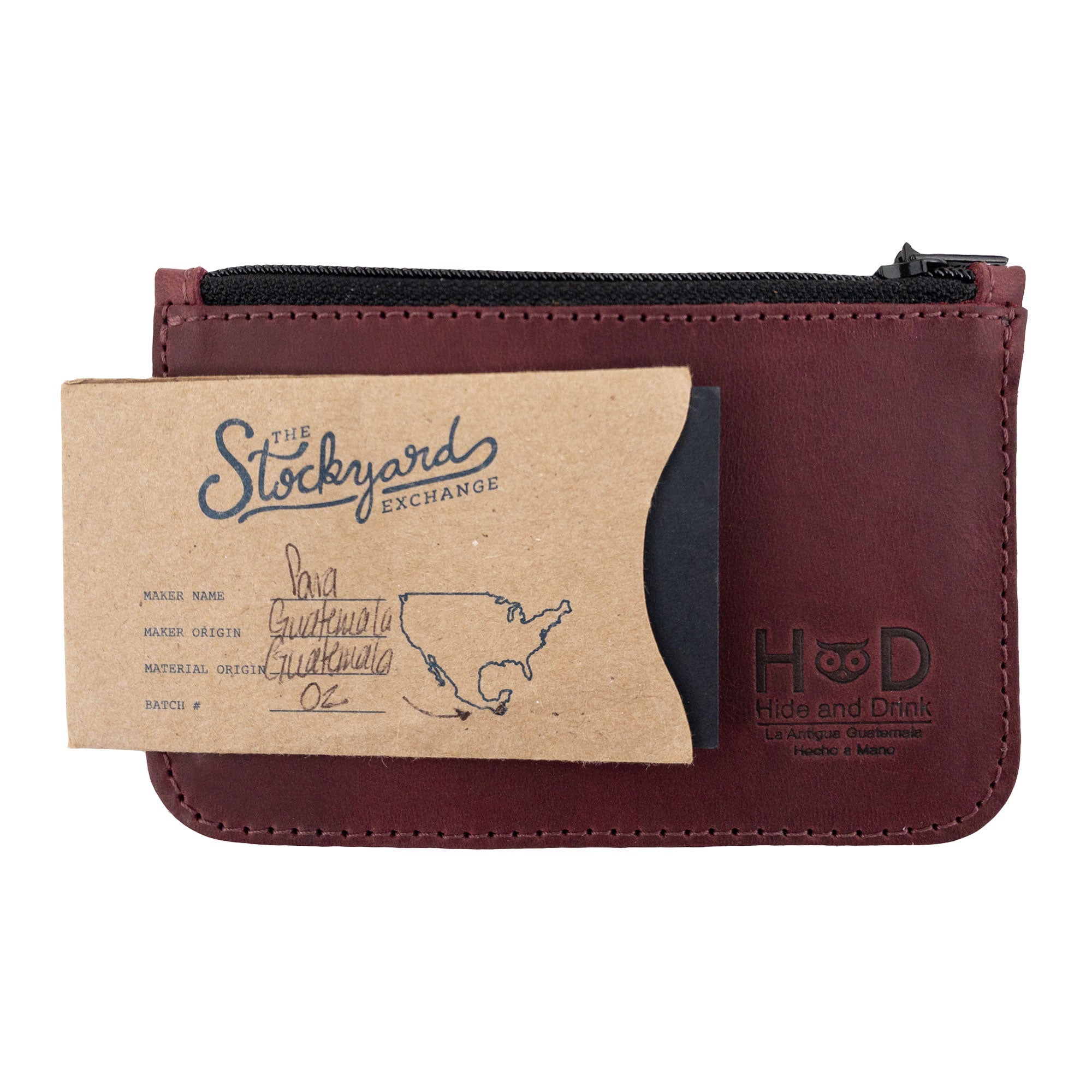The Hide & Drink zippered wallet displaying a business card alongside its sleek design, emphasizing its use as a Card Case, ideal for folded bills and coins, crafted from Full Grain Leather.