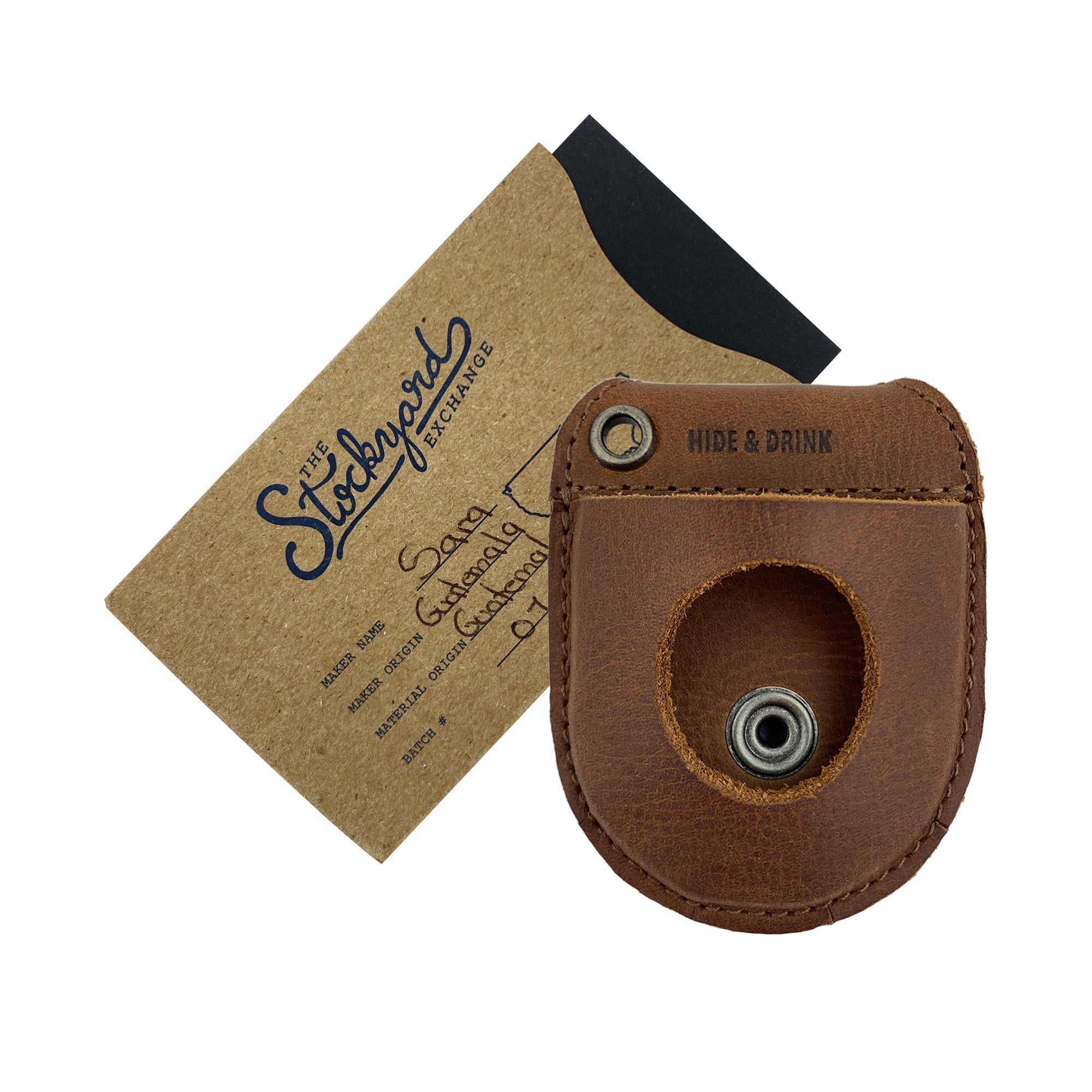 Hide & Drink Pocket Watch Holder and Case displayed with a sleek black leather exterior, showcasing its stylish appeal. This pocket watch case serves as a rustic protector holder, crafted from full grain leather with hand sewing and fire branding, highlighting artisan quality and small batch production. Handmade in La Antigua Guatemala & Oaxaca Mexico.