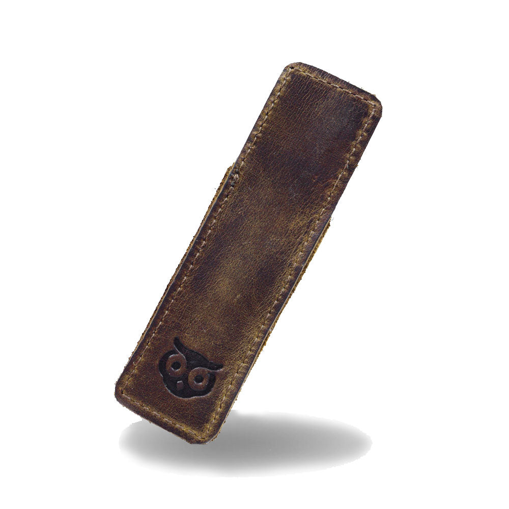 Hide & Drink Fisher Space Pen Case featuring a distinctive owl branding on rustic full grain leather. This handmade individual sleeve is perfect for 3.75 in. adjustable pens, blending functionality and aesthetic appeal as an office pouch. Crafted with care in La Antigua Guatemala and Oaxaca Mexico, it highlights small batch production and artisan skills.