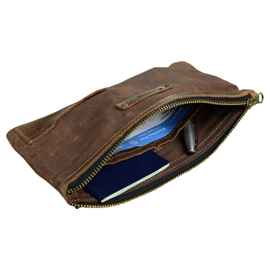 Inside view of the Traveler Organizer by Hide & Drink, showcasing compartments for travel essentials. This All Purpose Utility Pouch is crafted with Waxed Canvas & Full Grain Leather, perfect for Travel Accessories and camping organization. Handmade through Small Batch Production, it reflects the artistry of artisans in La Antigua Guatemala & Oaxaca Mexico.