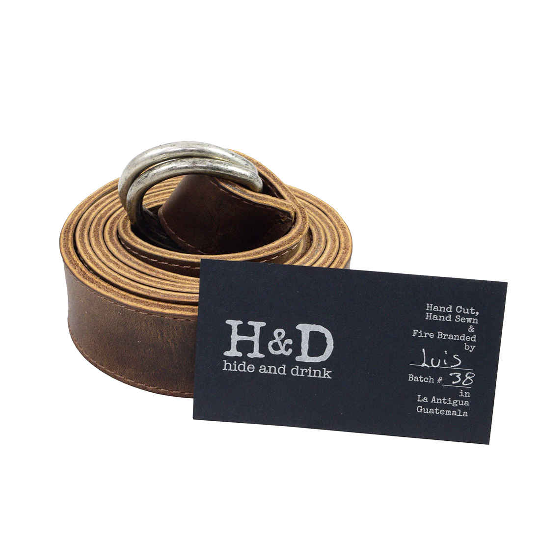 Hide & Drink D-Ring Leather Belt featuring the brand's signature craftsmanship and branding. This 1.25 in. Wide Belt with D-Ring Buckle is perfect for size 30 to 34. Made from premium Full Grain Leather, it's a handmade piece that reflects the dedication to quality from artisans in La Antigua Guatemala & Oaxaca Mexico.