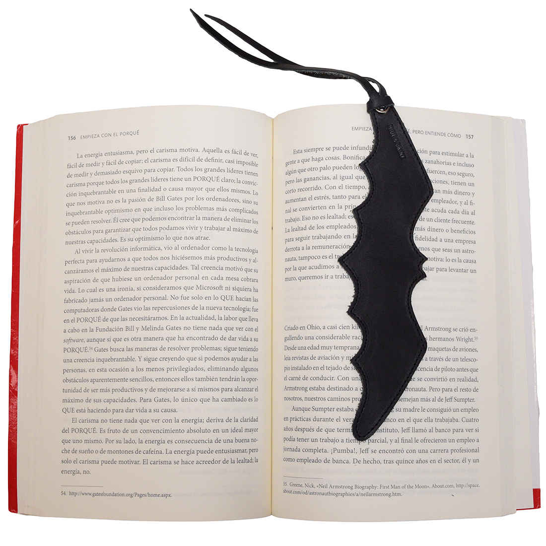 Leather Bat Bookmark from Hide & Drink inserted in an opened book, highlighting its practical use for avid readers. This Bat Bookmark is a stylish gift for bookworm friends, combining function and flair. Each piece is hand cut and sewn, offering artisan craftsmanship from Guatemala and Mexico.