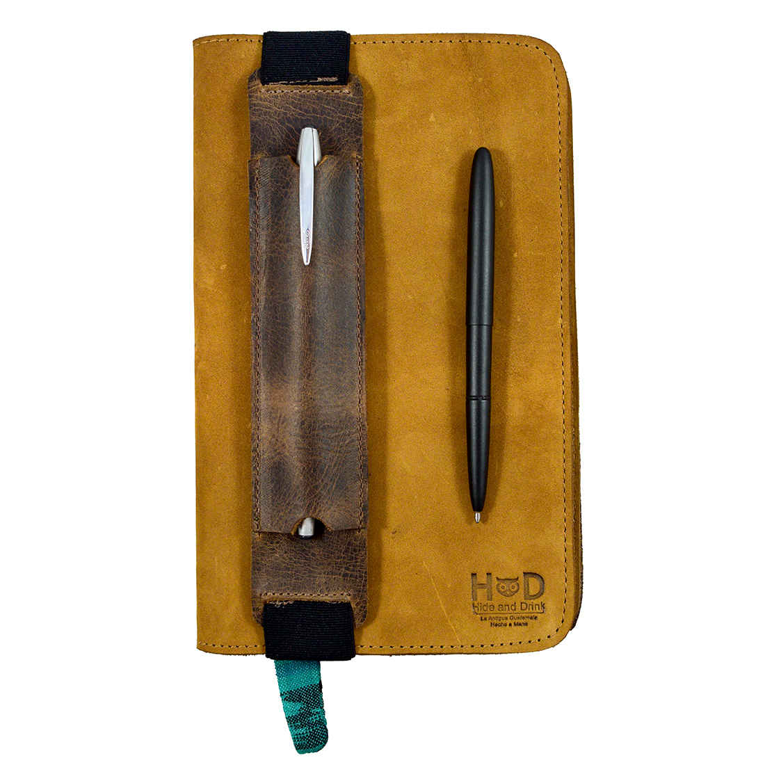 Hide & Drink Pen Holster in mustard full grain leather, complete with a durable pen sleeve, designed for 6 to 7 inch tall notebooks. Handmade by artisans in La Antigua Guatemala & Oaxaca Mexico, this pen pouch combines functionality with classic style.