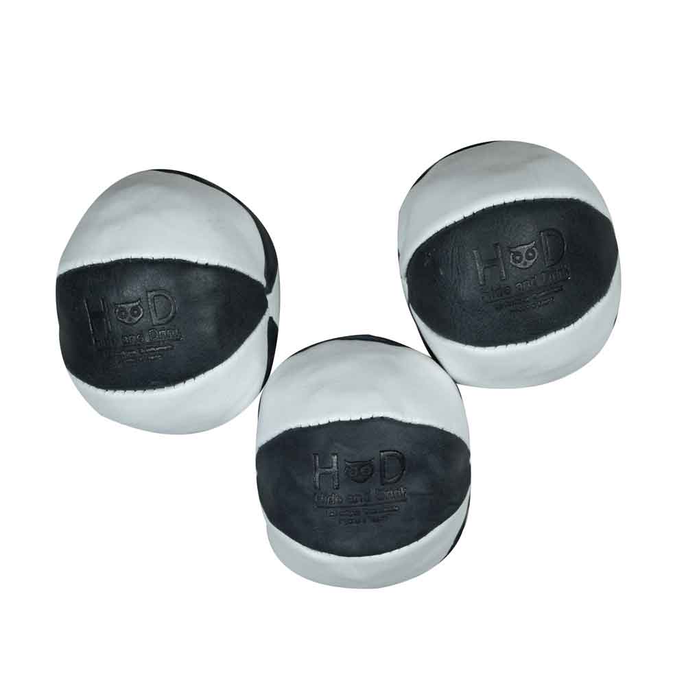 Hide & Drink Leather Juggling Balls (3-Pack) presented in classic black and white colors. Full Grain Leather Juggling Balls Set of 3, crafted through Small Batch Production techniques, Hand Cut, Hand Sewn, and Fire Branded by expert Artisans. Handmade in La Antigua Guatemala & Oaxaca Mexico.