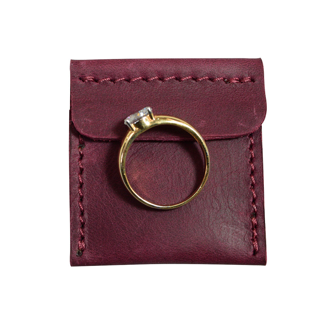 Hide & Drink Wedding Ring Case focusing on its design ideal for engagement rings, highlighted by full grain leather craftsmanship. Perfect for travel, this pouch organizer for jewelry is handmade in La Antigua Guatemala & Oaxaca Mexico.