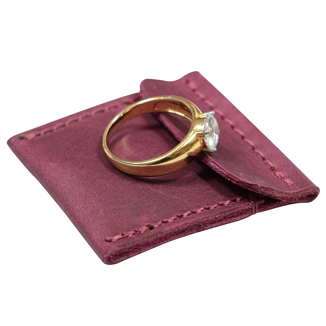 Hide & Drink Wedding Ring Case elegantly showcasing its unique leather texture. This work of art serves as an engagement rings case and pouch organizer for jewelry, hand sewn by artisans in La Antigua Guatemala & Oaxaca Mexico.