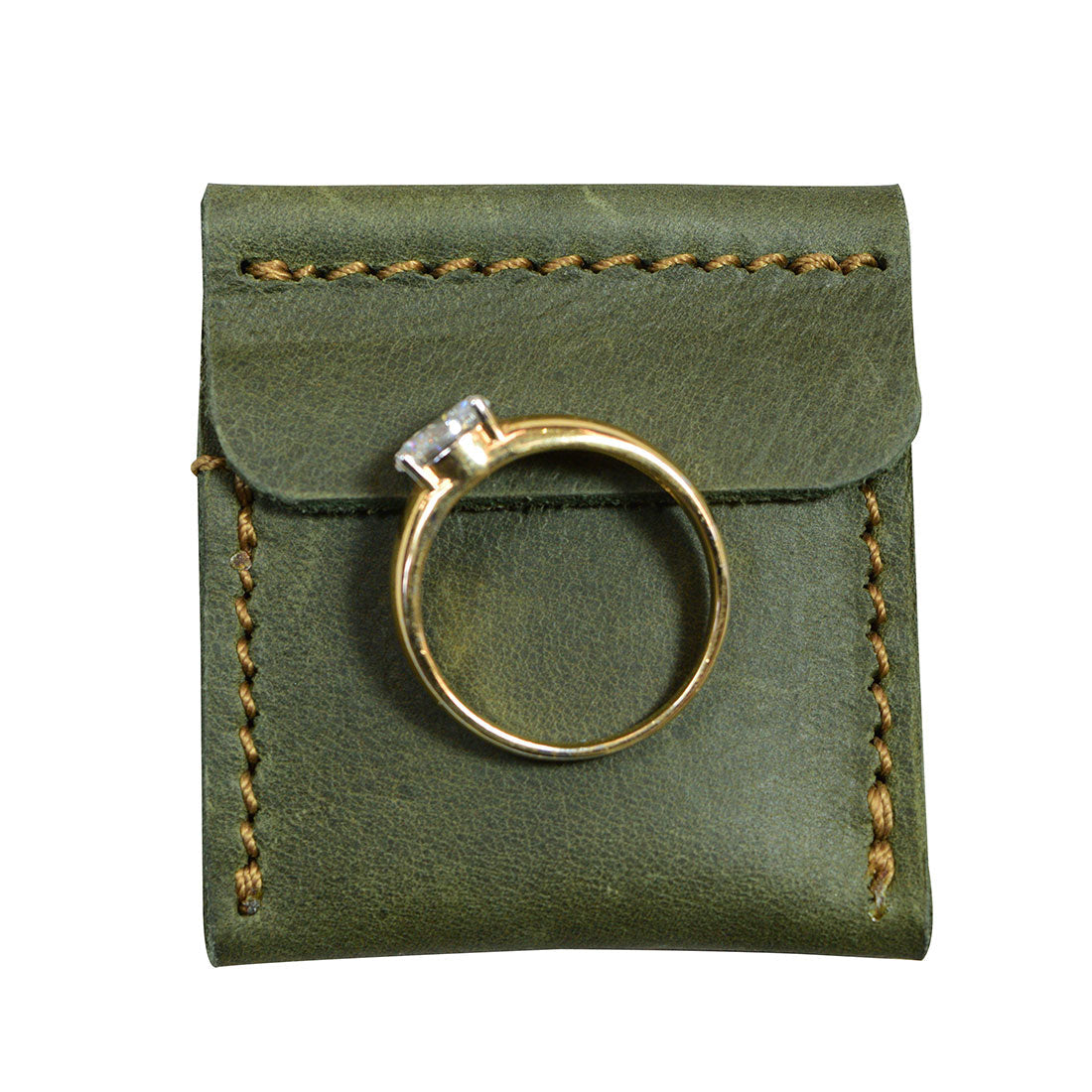 Showcasing Hide & Drink Wedding Ring Case featuring an engagement ring, designed for elegance and practicality. Ideal as a small bearer or pouch organizer for travel, crafted from full grain leather in La Antigua Guatemala & Oaxaca Mexico.